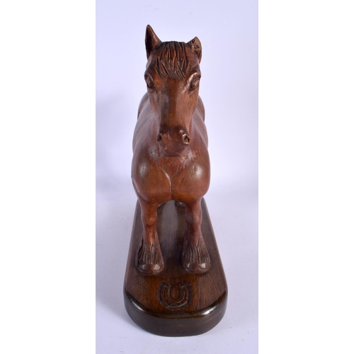 303 - A LARGE 1950S CARVED OAK FIGURE OF A STANDING HORSE in the manner of Robert Mouseman. 30 cm x 27 cm.