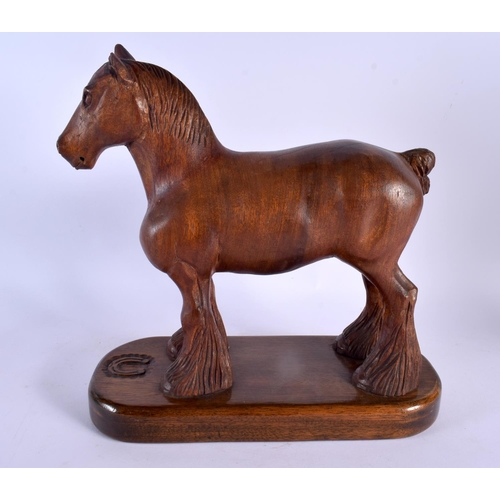 303 - A LARGE 1950S CARVED OAK FIGURE OF A STANDING HORSE in the manner of Robert Mouseman. 30 cm x 27 cm.