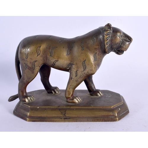 309 - A 19TH CENTURY MIDDLE EASTERN INDIAN BRONZE FIGURE OF A TIGER modelled upon a shaped plinth. 13 cm x... 