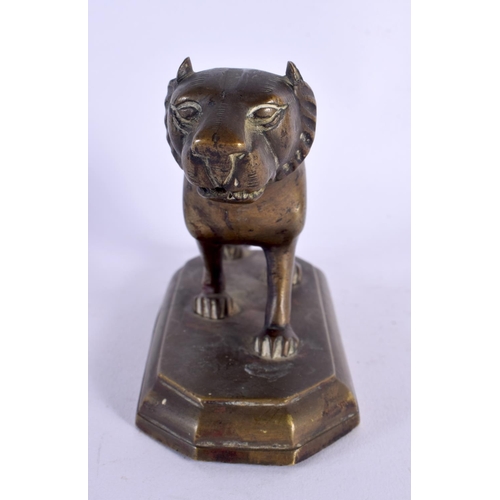 309 - A 19TH CENTURY MIDDLE EASTERN INDIAN BRONZE FIGURE OF A TIGER modelled upon a shaped plinth. 13 cm x... 