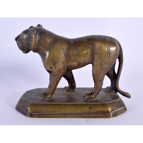 309 - A 19TH CENTURY MIDDLE EASTERN INDIAN BRONZE FIGURE OF A TIGER modelled upon a shaped plinth. 13 cm x... 