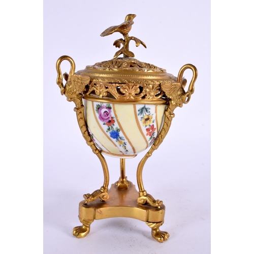 31 - A 19TH CENTURY FRENCH ORMOLU AND PORCELAIN INKWELL painted with flowers. 15 cm x 7 cm.