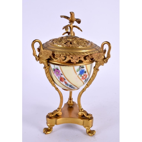 31 - A 19TH CENTURY FRENCH ORMOLU AND PORCELAIN INKWELL painted with flowers. 15 cm x 7 cm.