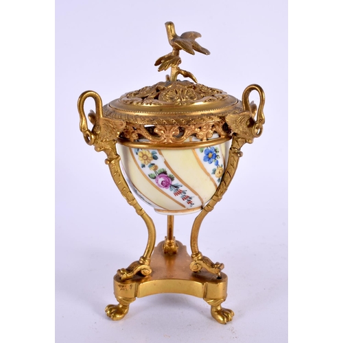 31 - A 19TH CENTURY FRENCH ORMOLU AND PORCELAIN INKWELL painted with flowers. 15 cm x 7 cm.