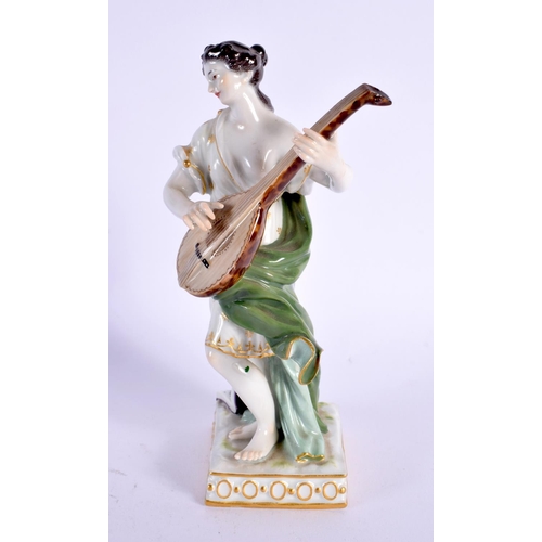 313 - A MEISSEN PORCELAIN FIGURE OF A MUSICIAN. 16 cm high.