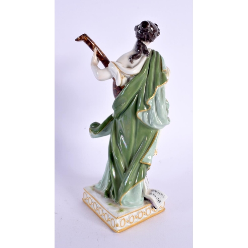 313 - A MEISSEN PORCELAIN FIGURE OF A MUSICIAN. 16 cm high.