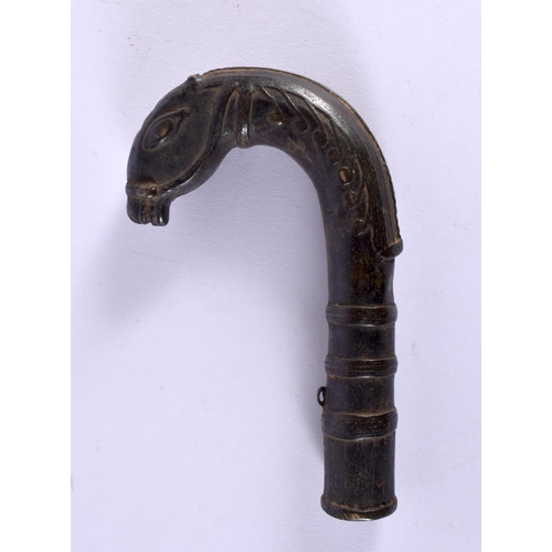 314 - AN 18TH/19TH CENTURY MIDDLE EASTERN MUGHAL BRONZE CANE HANDLE formed as a stylised horse. 16 cm x 8 ... 