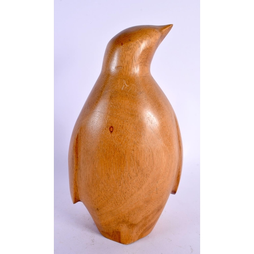 320 - A FOLK ART CARVED WOOD FIGURE OF A PENGUIN. 24 cm high.