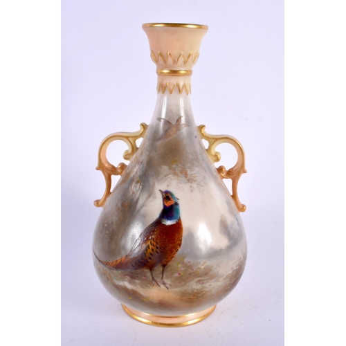 33 - A ROYAL WORCESTER TWIN HANDLED PORCELAIN VASE by James Stinton. 14 cm high.