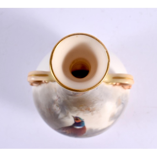 33 - A ROYAL WORCESTER TWIN HANDLED PORCELAIN VASE by James Stinton. 14 cm high.