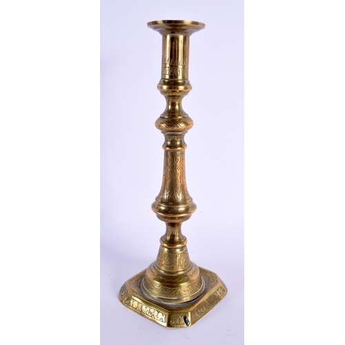 337 - A 19TH CENTURY MIDDLE EASTERN STYLE ISLAMIC BRASS CANDLESTICK. 25 cm high.