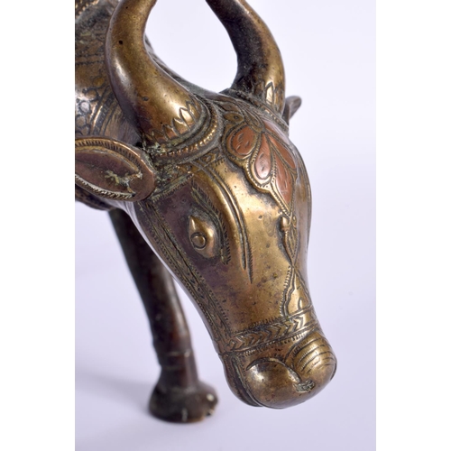 347 - A FINE 18TH CENTURY INDIAN BRONZE FIGURE OF A BULLOCK  modelled wearing floral embellished robes. 25... 