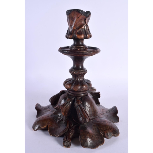 357 - A LARGE 19TH CENTURY BAVARIAN BLACK FOREST CARVED WOOD CANDLESTICKS overlaid with leaves. 26 cm x 12... 