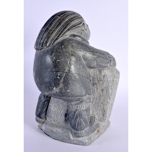 358 - AN UNUSUAL LARGE NORTH AMERICAN INUIT CARVED STONE FIGURE modelled as an hunter. 30 cm x 13 cm.