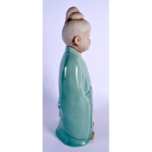 366 - AN UNUSUAL EARLY 20TH CENTURY JAPANESE TAISHO PERIOD CELADON PORCELAIN FIGURE modelled as a young bo... 