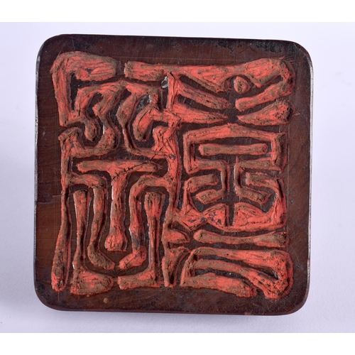 368 - A VERY UNUSUAL 19TH CENTURY CHINESE CARVED HARDWOOD SEAL Qing, possibly Zitan, modelled as a seated ... 