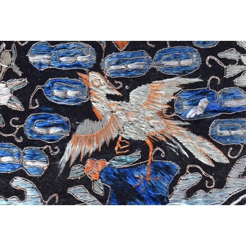 369 - A 19TH CENTURY CHINESE SILKWORK EMBROIDERED DOUBLE RANK BADGE depicting birds amongst foliage. 48 cm... 