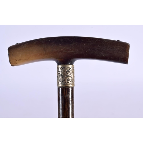 377 - A 19TH CENTURY CONTINENTAL CARVED RHINOCEROS HORN HANDLED SWAGGER STICK. 66 cm long.