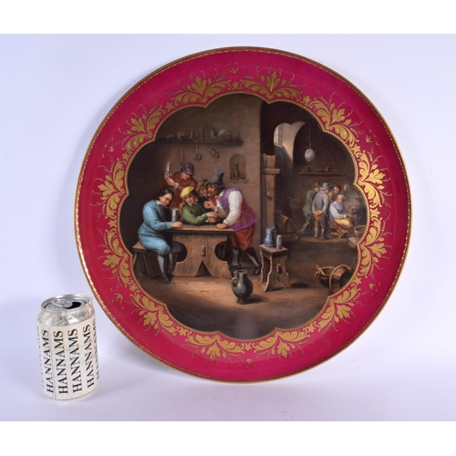 38 - A LARGE ANTIQUE VIENNA PORCELAIN DISH painted with figures in a landscape. 42 cm diameter.