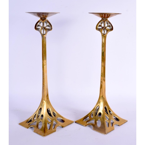 381 - A LARGE PAIR OF ARTS AND CRAFTS BRASS CANDLESTICKS. 34 cm high.