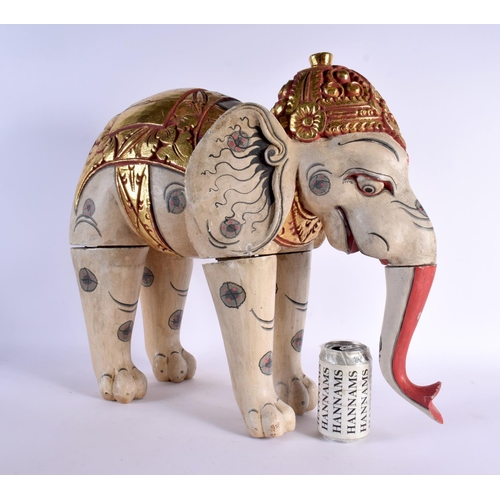 383 - A LARGE INDIAN FOLK ART CARVED AND PAINTED WOOD CIRCUS ELEPHANT modelled with gilt embellished highl... 