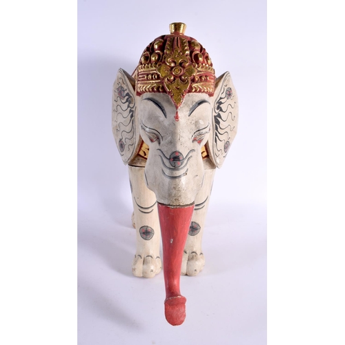 383 - A LARGE INDIAN FOLK ART CARVED AND PAINTED WOOD CIRCUS ELEPHANT modelled with gilt embellished highl... 