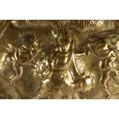 384 - A LARGE 19TH CENTURY MIDDLE EASTERN INDIAN EMBOSSED CHARGER decorated with figures in various pursui... 