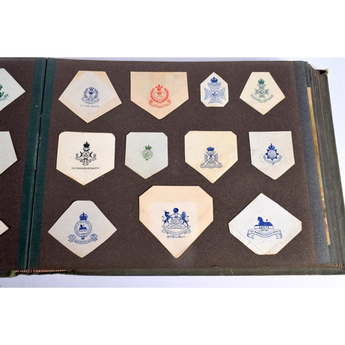 386 - A COLLECTION OF WWI MILITARY REGIMENTAL CUT OUTS together with photographs and a watercolour of Ypre... 