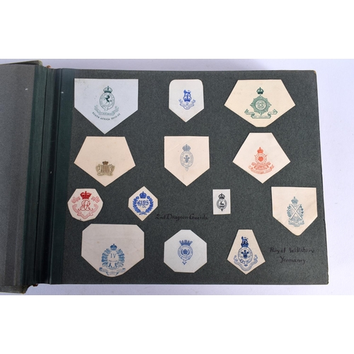 386 - A COLLECTION OF WWI MILITARY REGIMENTAL CUT OUTS together with photographs and a watercolour of Ypre... 