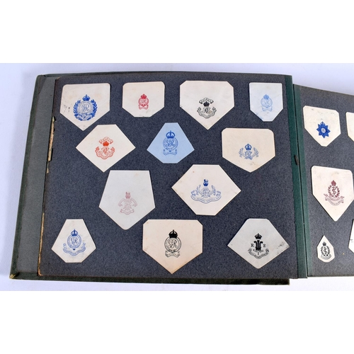 386 - A COLLECTION OF WWI MILITARY REGIMENTAL CUT OUTS together with photographs and a watercolour of Ypre... 