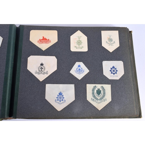 386 - A COLLECTION OF WWI MILITARY REGIMENTAL CUT OUTS together with photographs and a watercolour of Ypre... 