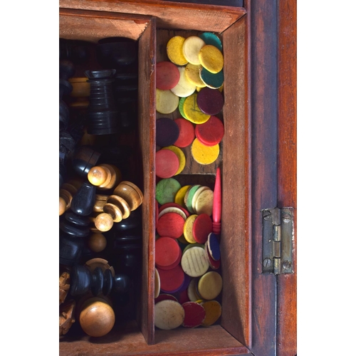 391 - A LOVELY EDWARDIAN MAHOGANY CASED GAMES COMPENDIUM containing chess, marbles, lead horses etc. 34 cm... 