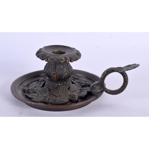 393 - A 19TH CENTURY EUROPEAN GRAND TOUR BRONZE CHAMBERSTICK decorated with berries and vines. 13 cm wide.