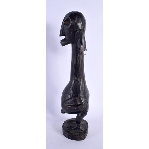 415 - AN AFRICAN TRIBAL CARVED WOOD FERTILITY FIGURE. 30 cm high.