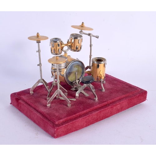 416 - A VINTAGE NOVELTY APPRENTICE MODEL DRUM KIT. 14 cm x 11 cm.