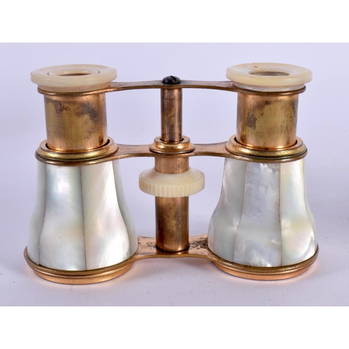 418 - A CASED PAIR OF VICTORIAN MOTHER OF PEARL OPERA GLASSES. 7 cm x 9 cm extended.