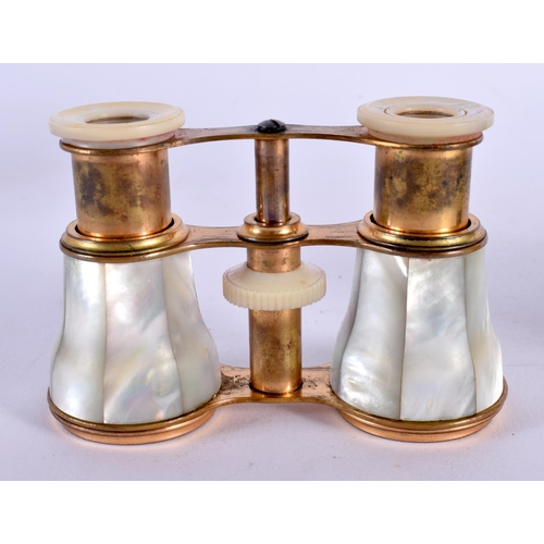 418 - A CASED PAIR OF VICTORIAN MOTHER OF PEARL OPERA GLASSES. 7 cm x 9 cm extended.