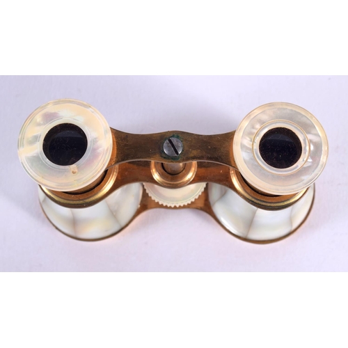 418 - A CASED PAIR OF VICTORIAN MOTHER OF PEARL OPERA GLASSES. 7 cm x 9 cm extended.