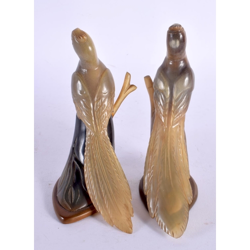 421 - A PAIR OF LATE 19TH CENTURY MIDDLE EASTERN CARVED BUFFALO HORN FIGURES modelled as birds. 12 cm high... 