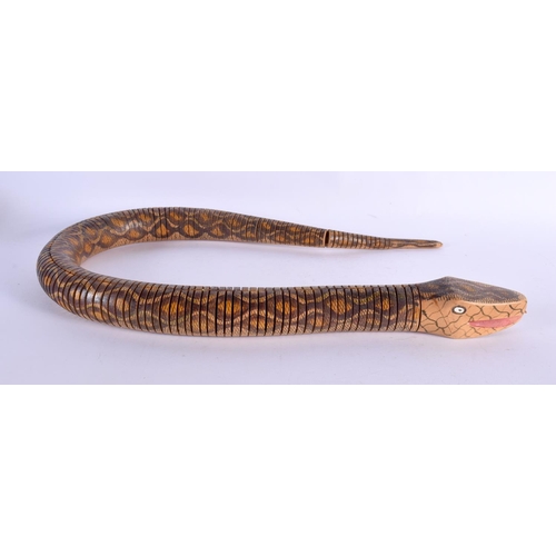 422 - A CHARMING VINTAGE FOLK ART RETICULATED WOODEN SNAKE. 90 cm long.