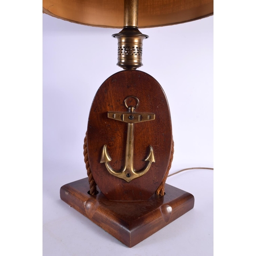 436 - A CHARMING LARGE EARLY 20TH CENTURY MARITIME LAMP overlaid with a brass anchor. 80 cm high.