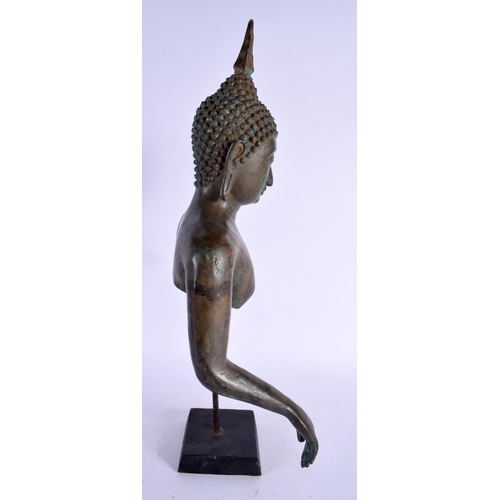 446 - A 19TH CENTURY THAI BRONZE BUDDHA FRAGMENT elegantly modelled with draped hands. 42 cm high.