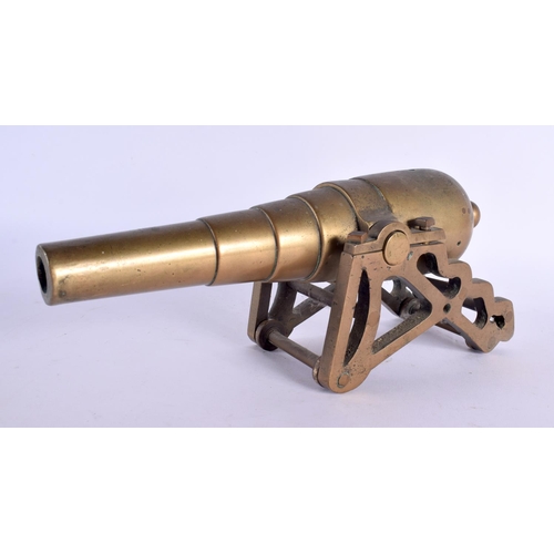 448 - A HEAVY ANTIQUE BRONZE DESK CANNON. 27 cm x 8 cm.