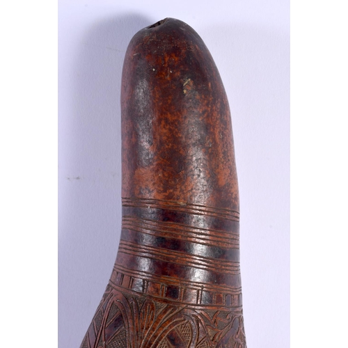 454 - AN UNUSUAL LARGE 19TH CENTURY CONTINENTAL ENGRAVED GOURD NUT decorated with figures in landscapes. 4... 