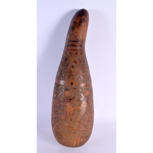 454 - AN UNUSUAL LARGE 19TH CENTURY CONTINENTAL ENGRAVED GOURD NUT decorated with figures in landscapes. 4... 