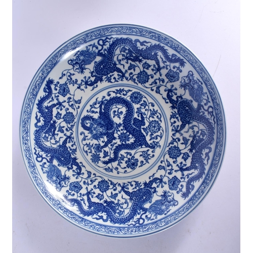 457 - A LARGE 18TH CENTURY CHINESE BLUE AND WHITE EXPORT PLATE Qianlong, together with a dragon dish. Larg... 