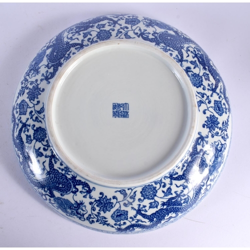 457 - A LARGE 18TH CENTURY CHINESE BLUE AND WHITE EXPORT PLATE Qianlong, together with a dragon dish. Larg... 