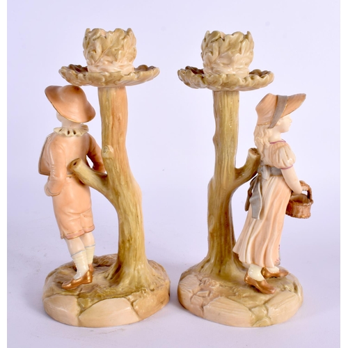 46 - A PAIR OF ROYAL WORCESTER FIGURAL CANDLESTICKS. 19 cm high.