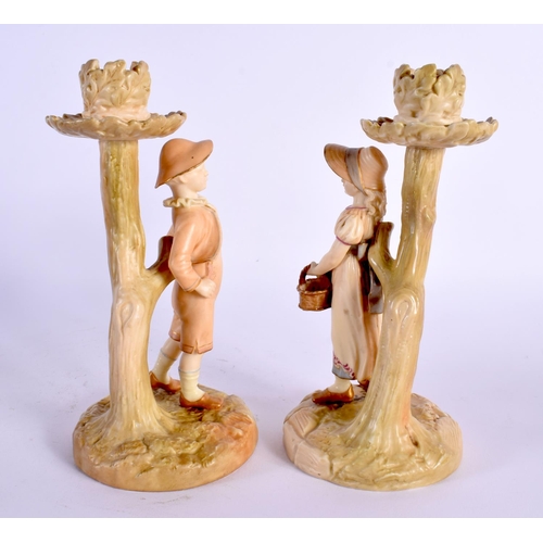 46 - A PAIR OF ROYAL WORCESTER FIGURAL CANDLESTICKS. 19 cm high.