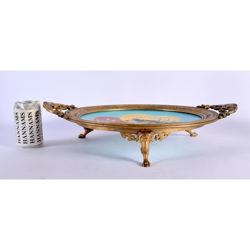 462 - A FINE 19TH CENTURY TWIN HANDLED FRENCH GILT BRONZE POTTERY DISH painted with birds. 48 cm wide.